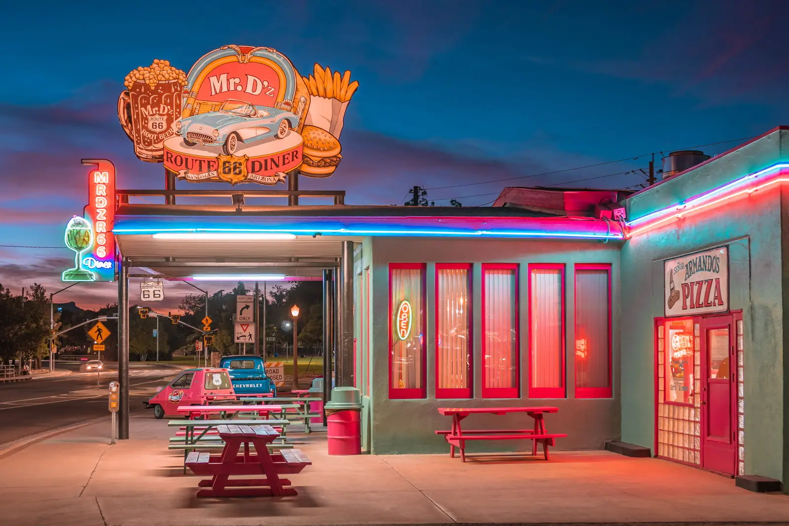 Neon-lit diner on historic Route 66 at dusk